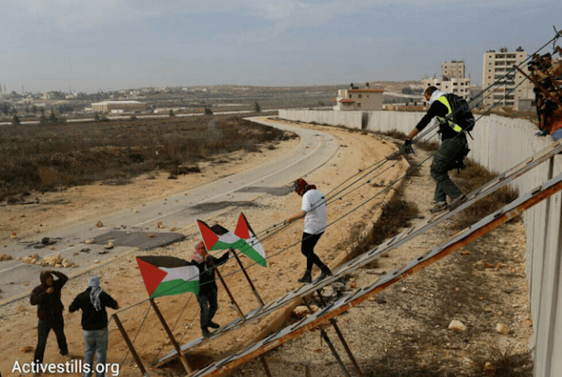 Palestinians cross Israeli apartheid wall. (Photo: via Activestills.org)